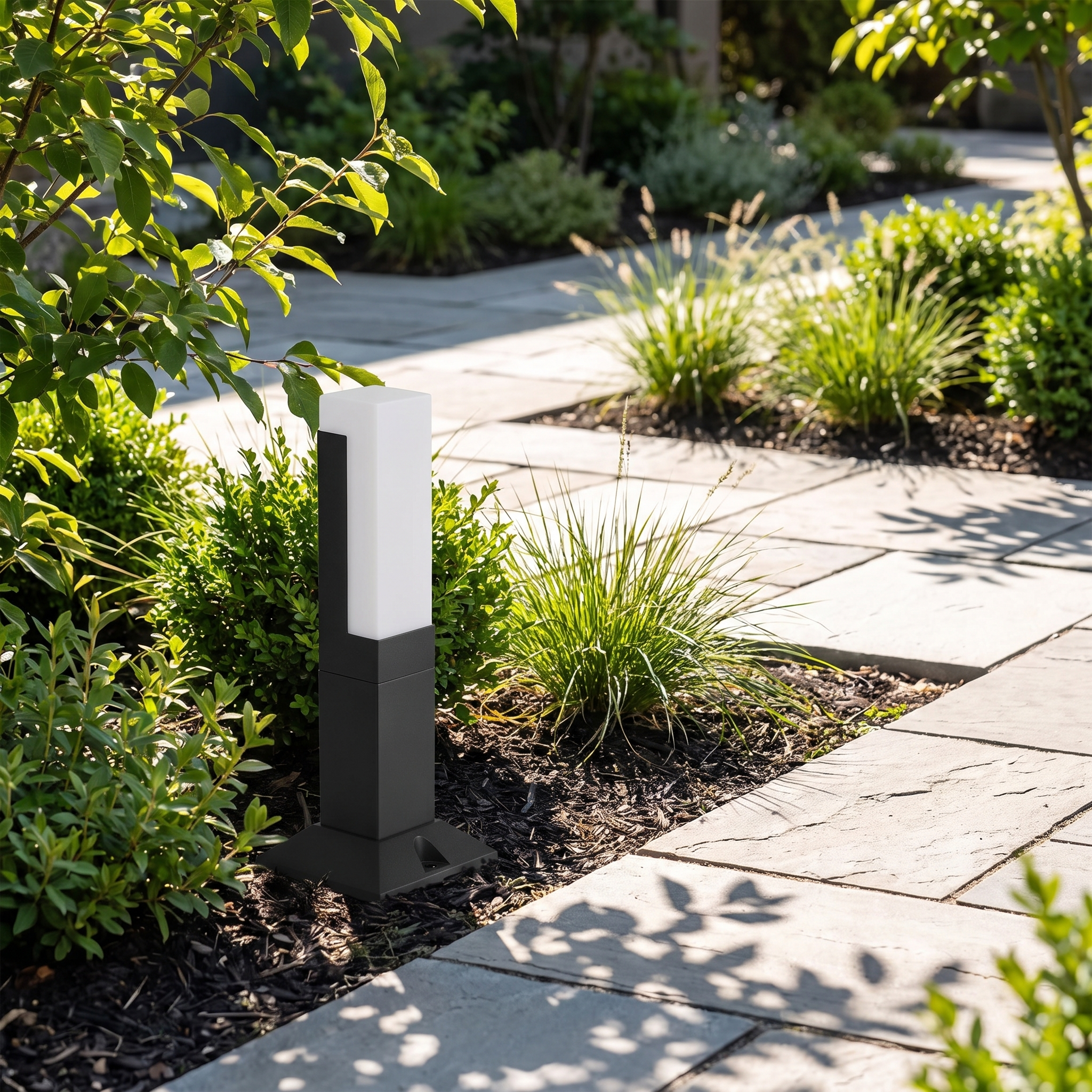 Meadow path light in a planted garden bed