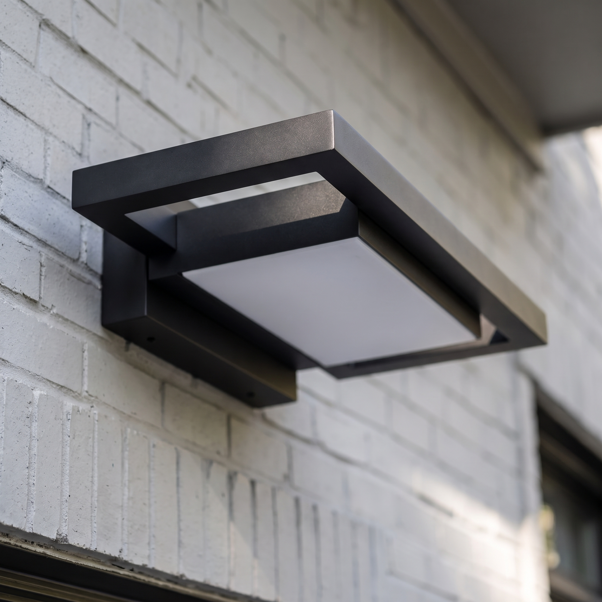 Brooklyn wall light black finish and machined edge detail