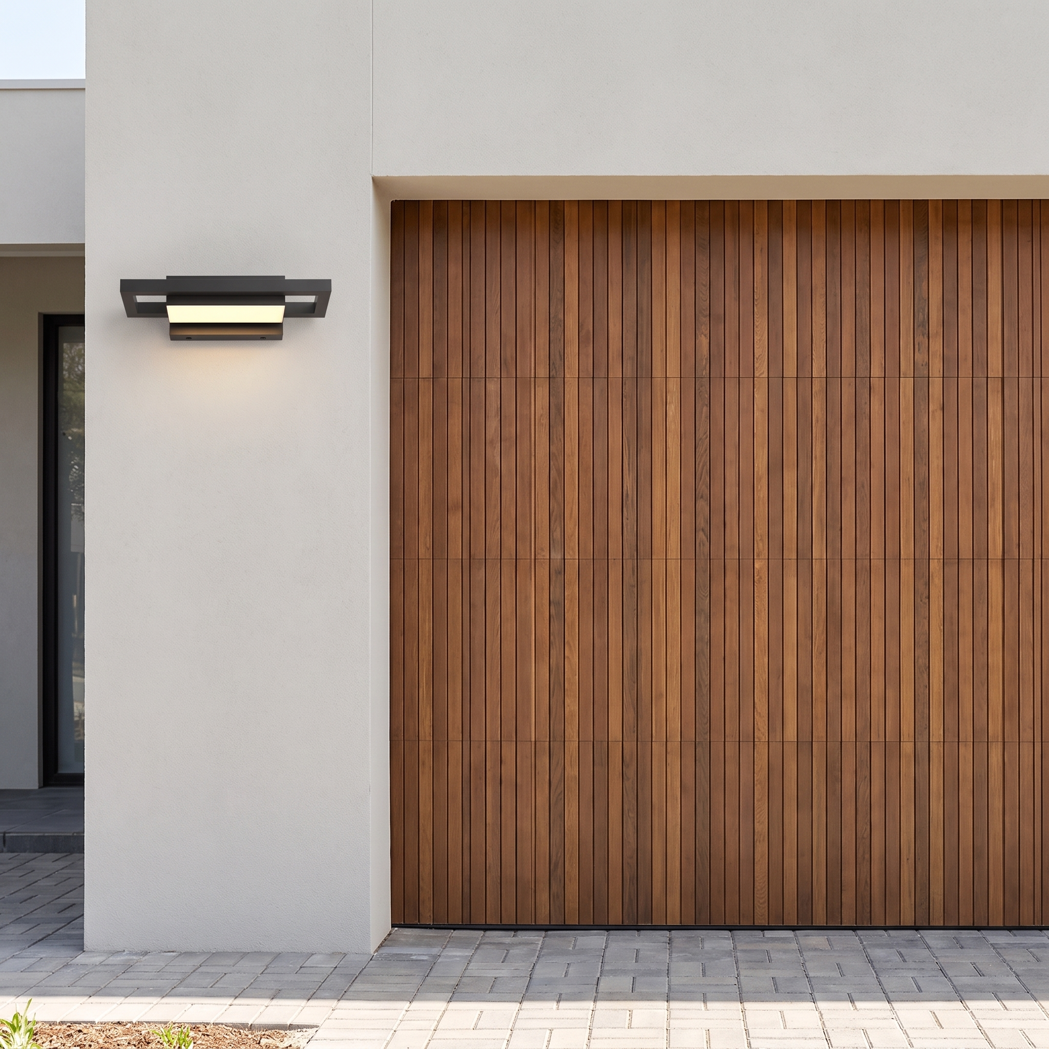 Brooklyn wall light beside a modern garage door